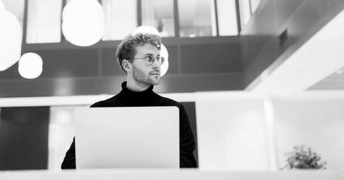 Professional using a laptop in a calm workplace